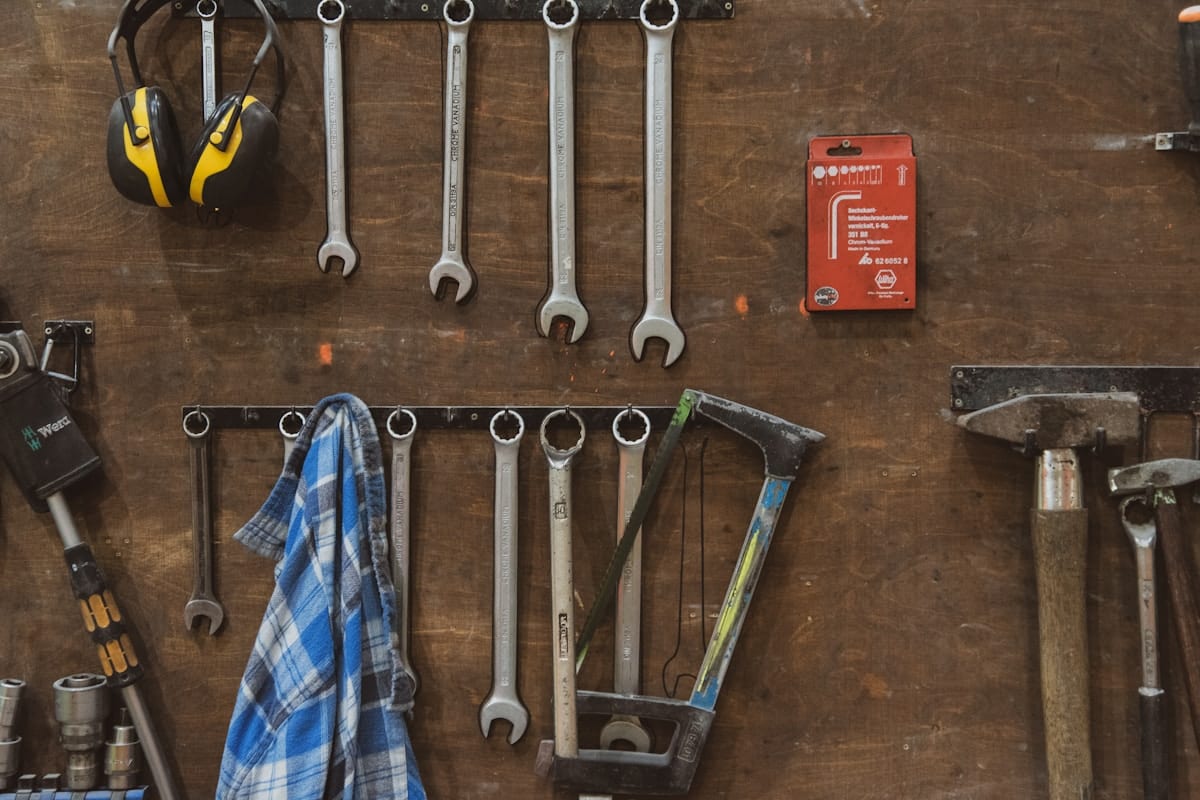 Hand tools hanging neatly on a workshop wall
